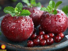 a group of red apples with leaves on top of each other