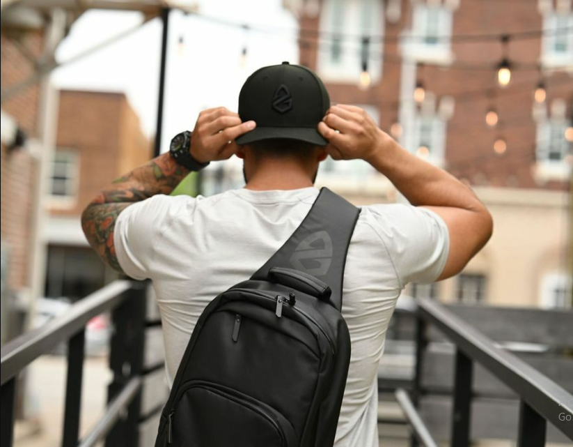 a man wearing a backpack and a hat