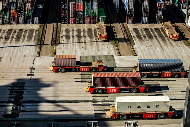 a group of trucks with containers