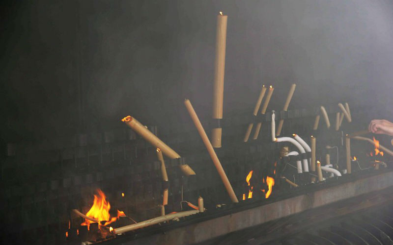 a group of candles burning in a fire