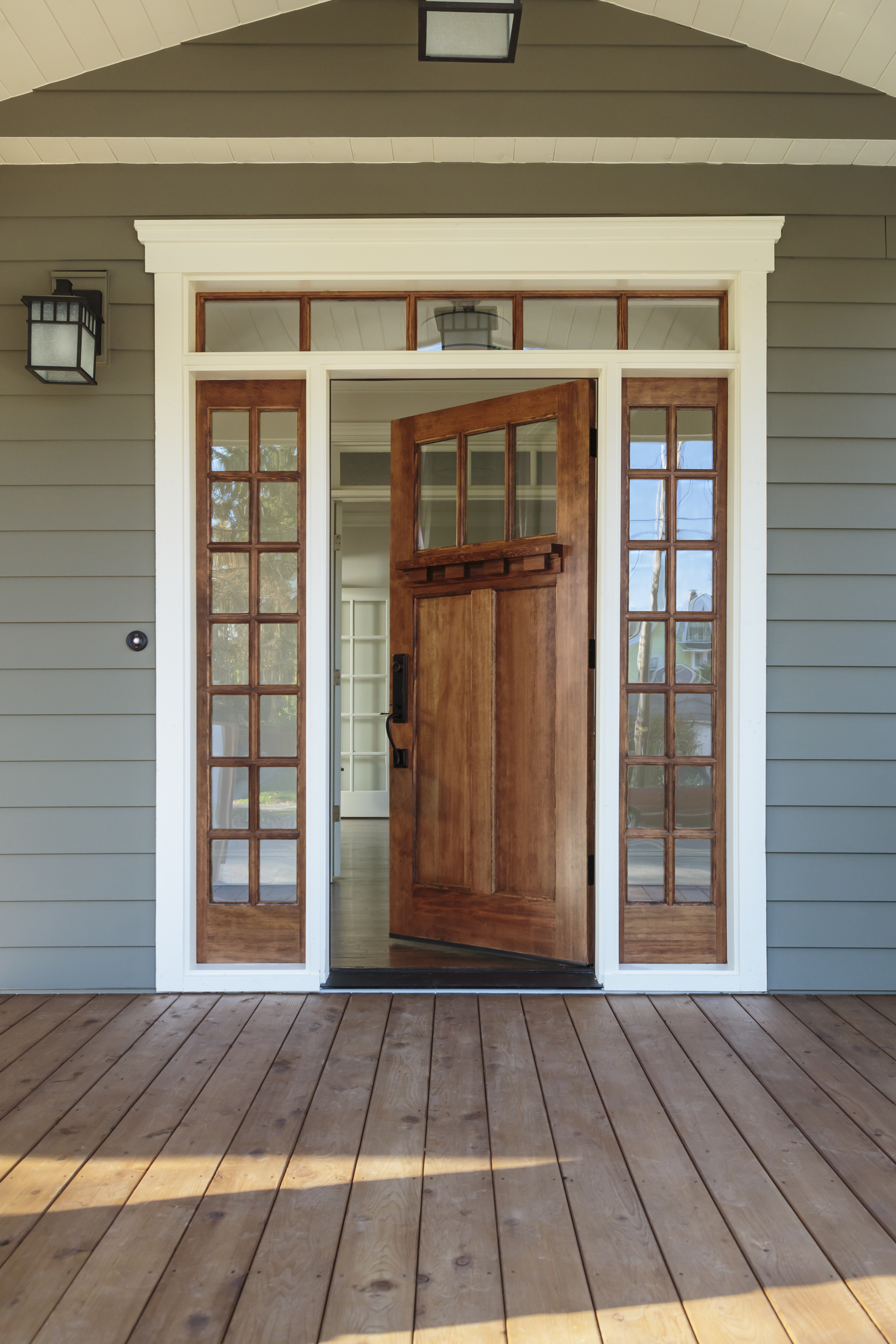 a wooden door with glass panes