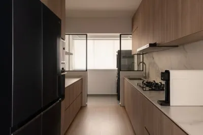 a kitchen with a black refrigerator and a black refrigerator