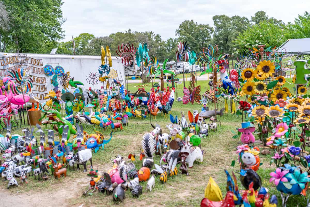 a group of colorful sculptures on grass