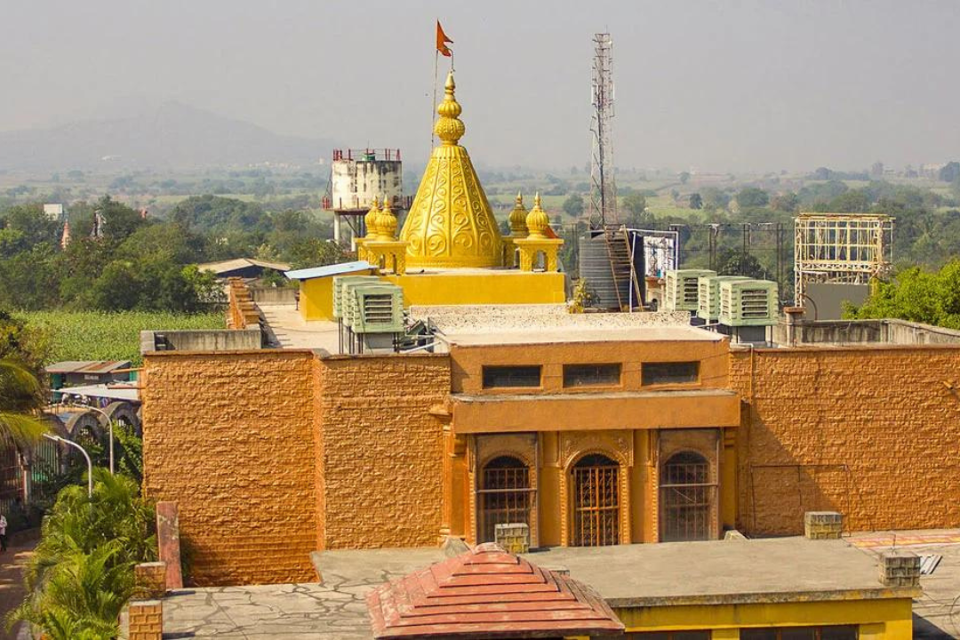 a building with a yellow dome and a flag on top