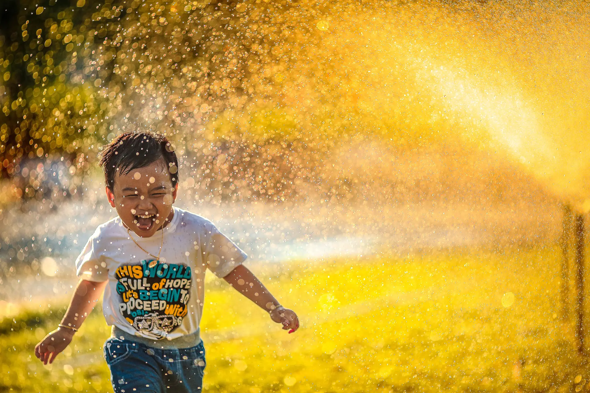 a boy running through water