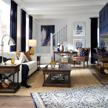 a living room with a blue and white rug