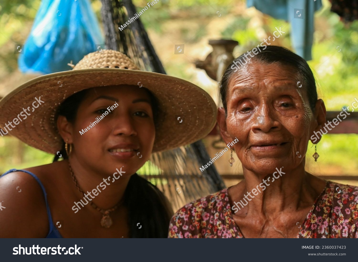 a woman and a young woman in straw hats