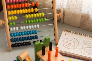 a colorful abacus and a notebook