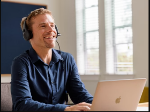 a man wearing headphones and smiling