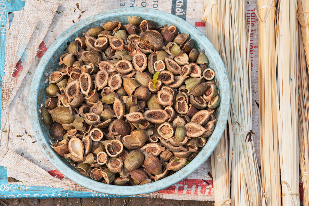 a bowl of nuts on a mat