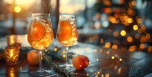 two glasses of oranges on a table