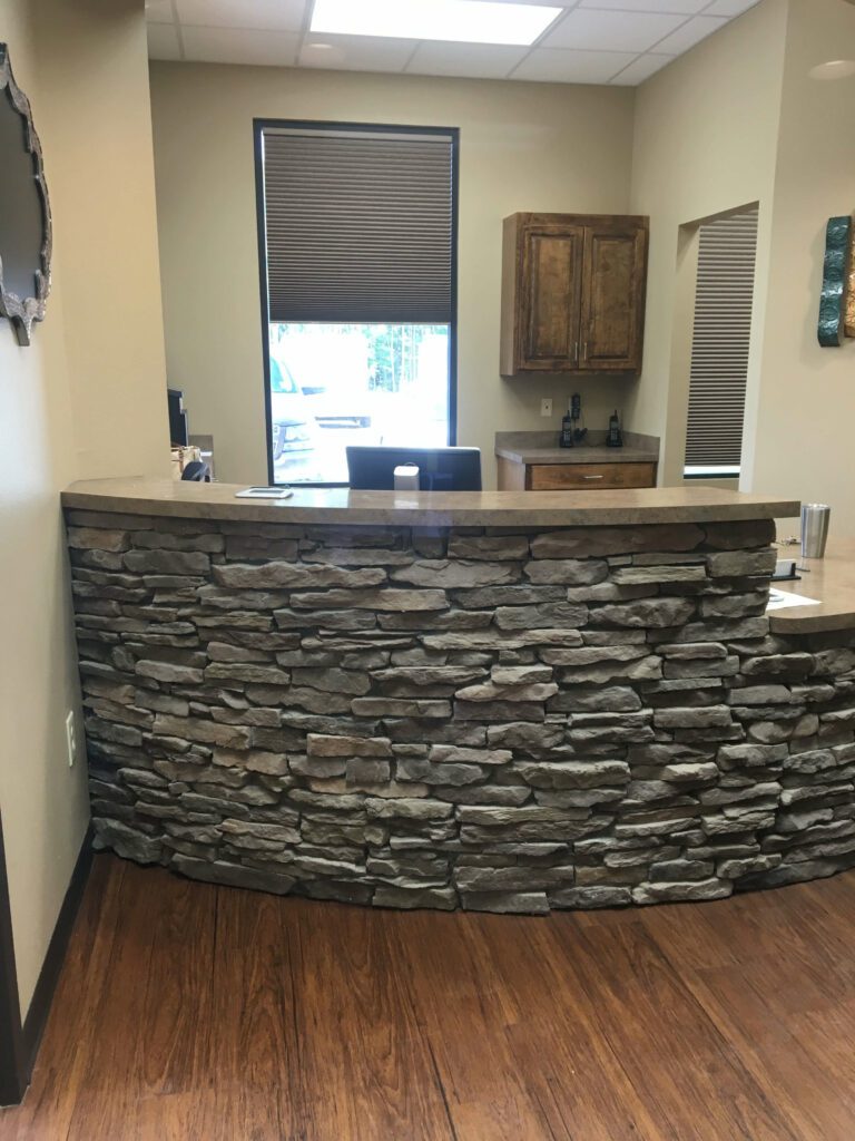 a stone wall in a room