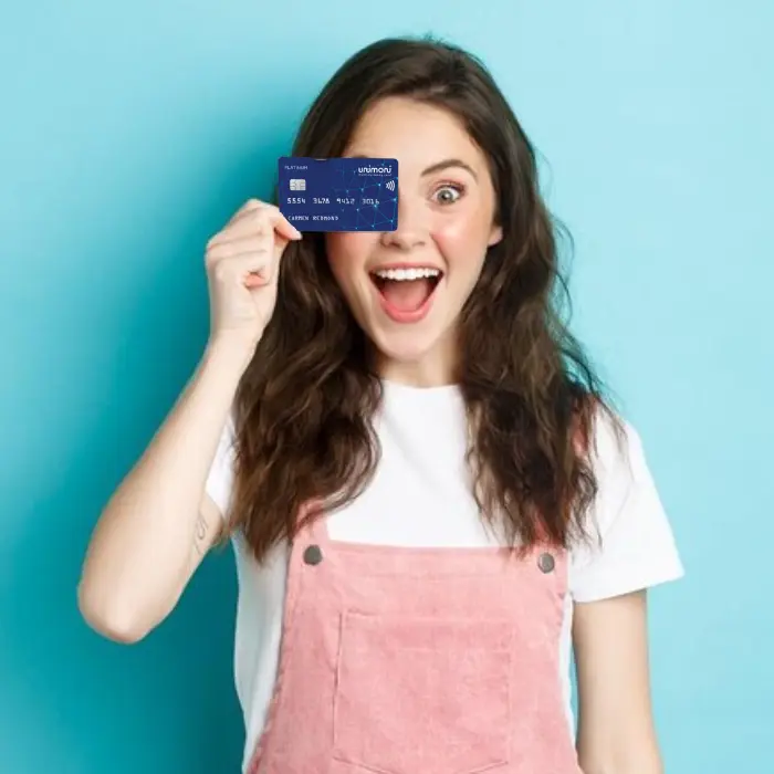 a woman holding a credit card