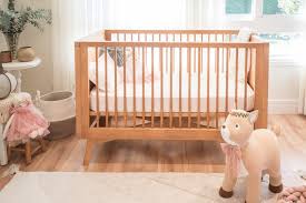 a crib with a stuffed animal in it