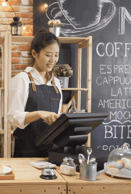 a woman standing at a cash register