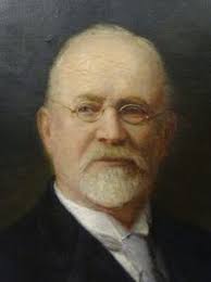 a man with a white beard and glasses