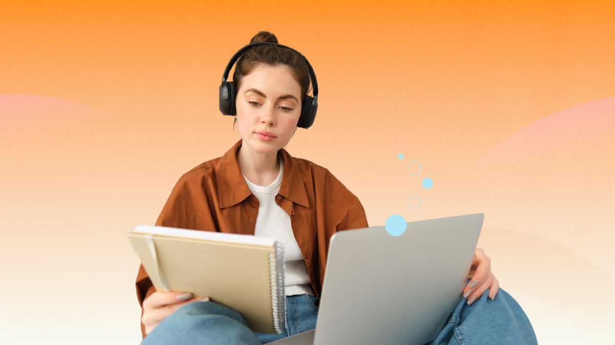 a woman wearing headphones and holding a laptop