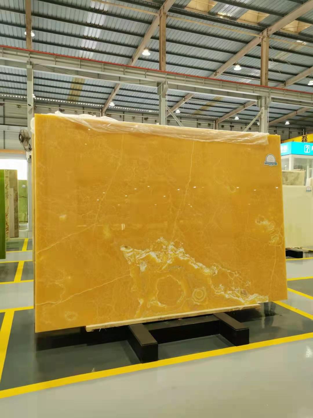 a large rectangular yellow stone in a warehouse
