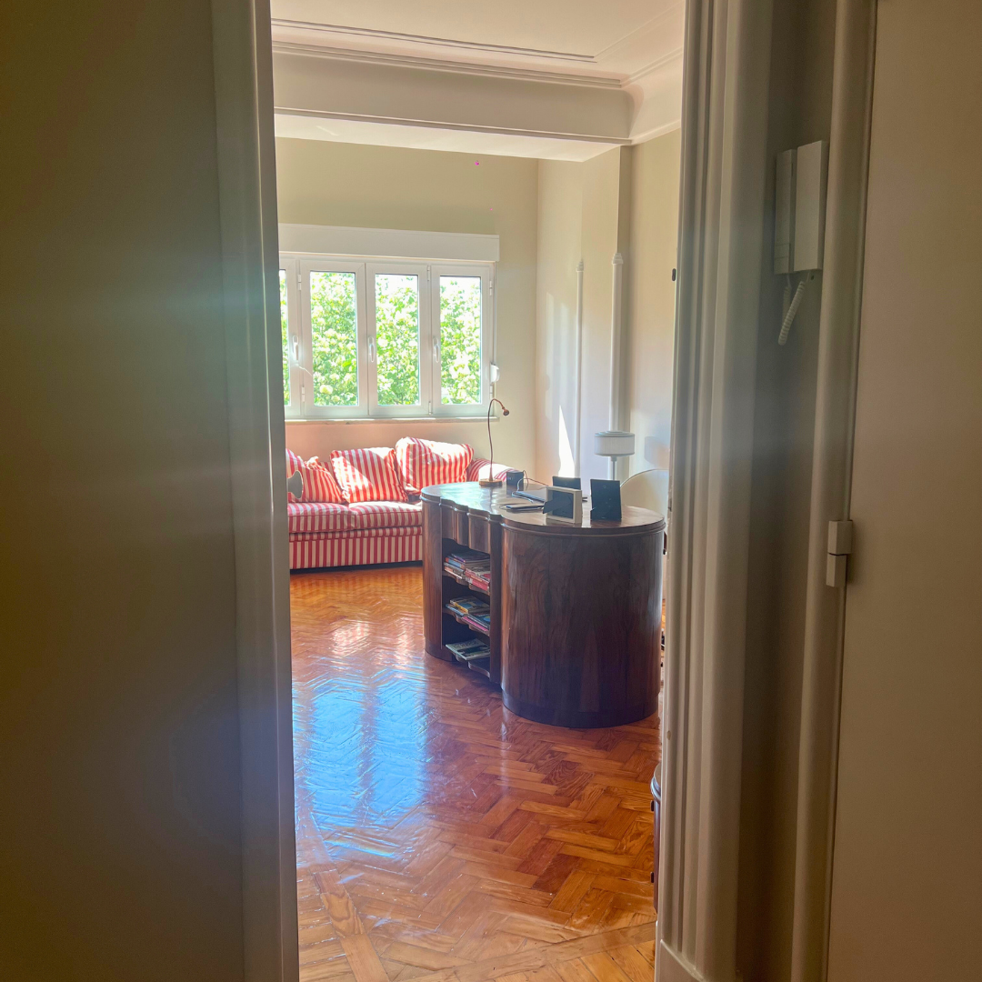 a room with a wood floor and a couch