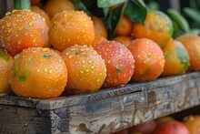 a group of oranges on a wooden surface