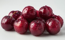 a group of cherries with water drops