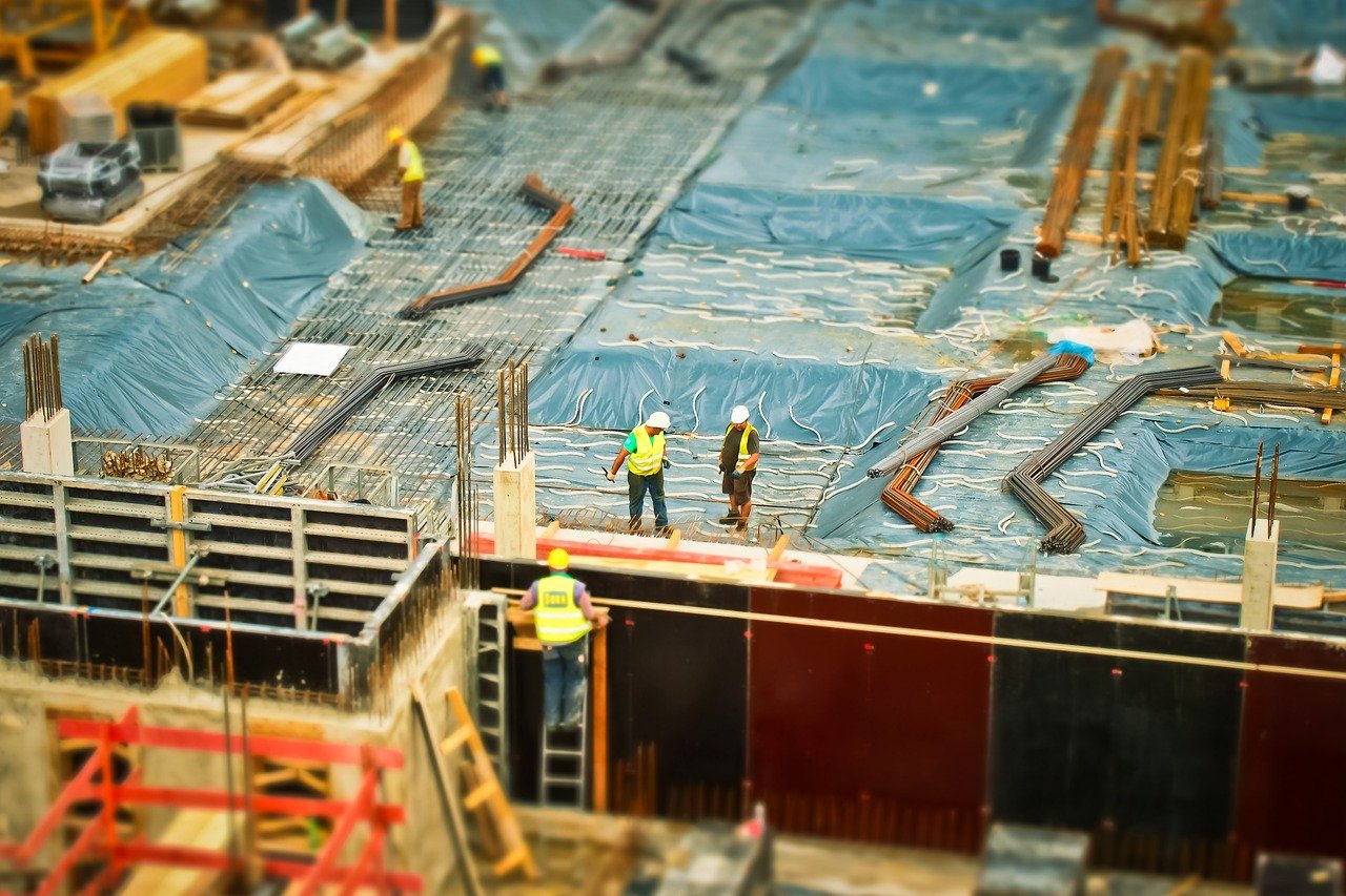 a group of construction workers at a construction site