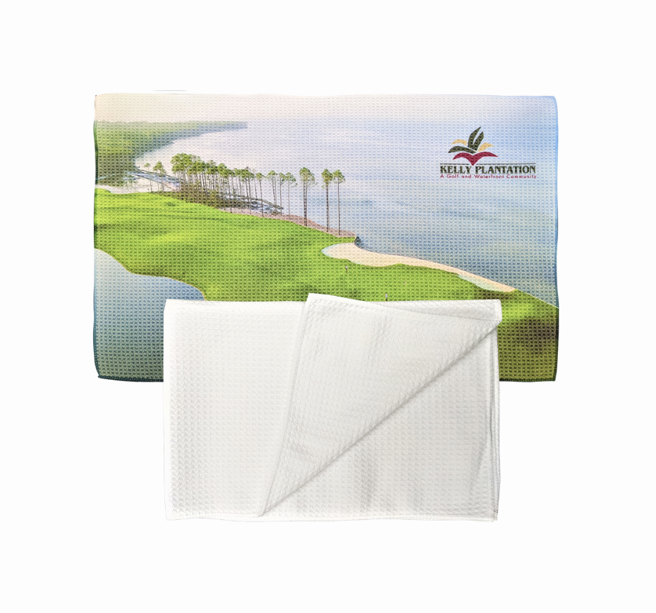 a white towel with a picture of a golf course and a lake