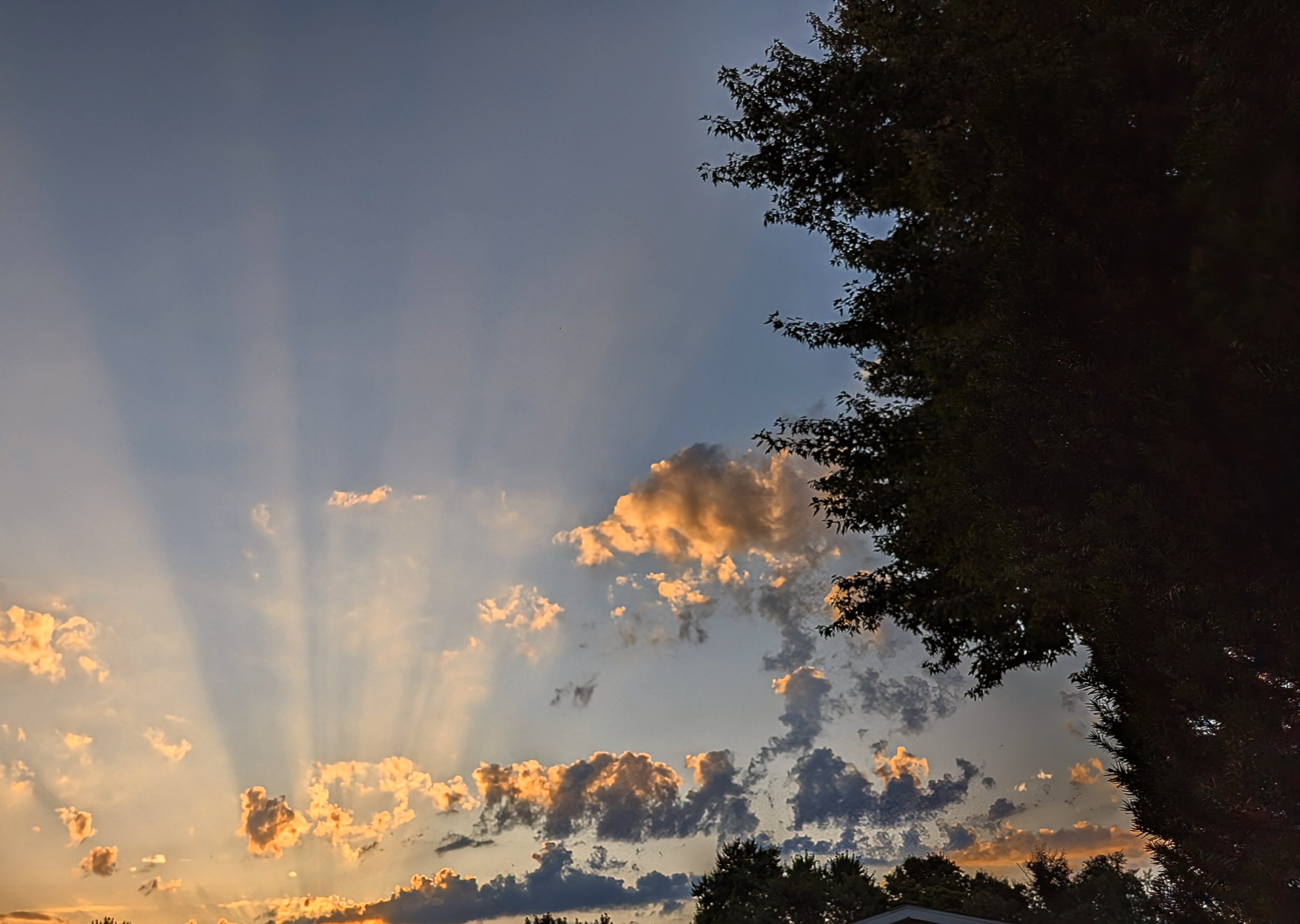 sun rays of light shining through clouds