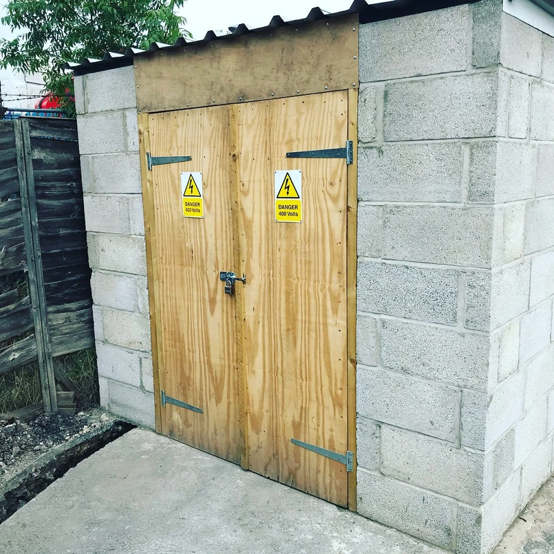 a wooden door with yellow signs on it