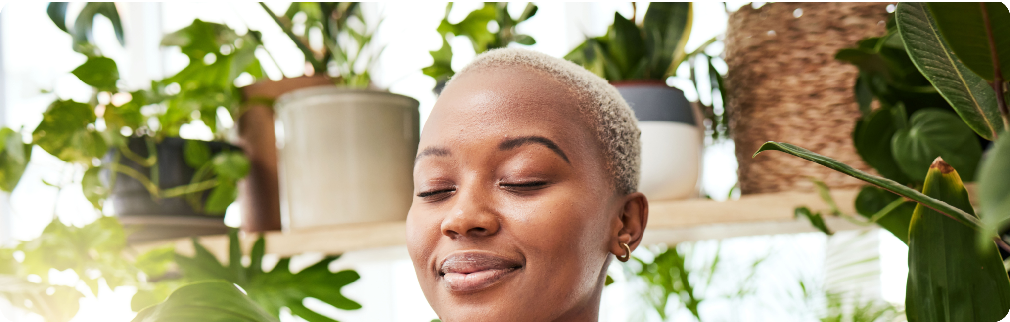 a woman with short hair and eyes closed