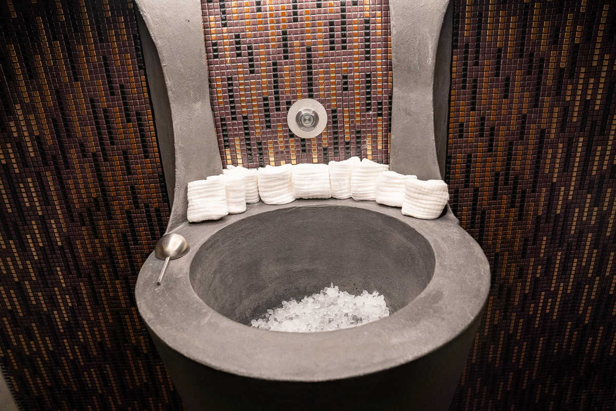 a toilet with ice and towels on it