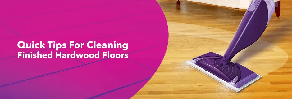 a person cleaning a hardwood floor