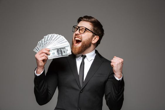 a man in a suit holding money