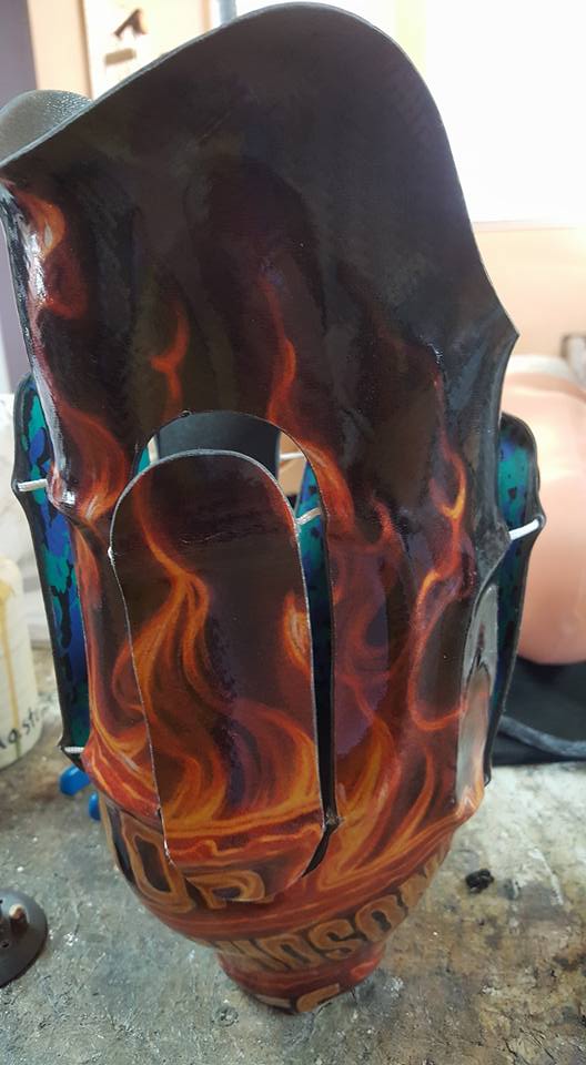 a metal mask with flames on it