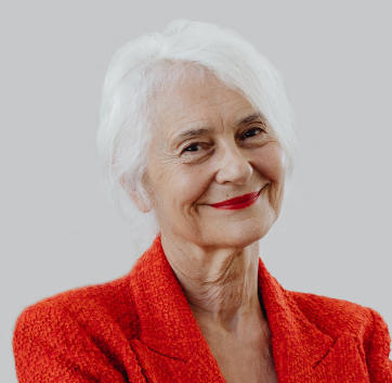 a woman with white hair and red lipstick smiling