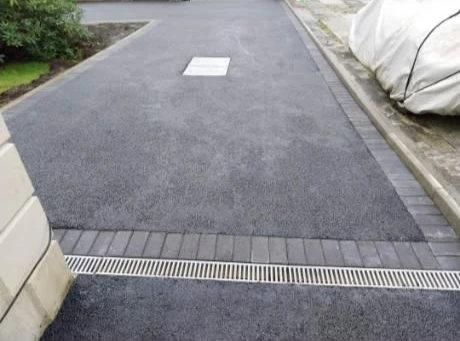 a road with a drain