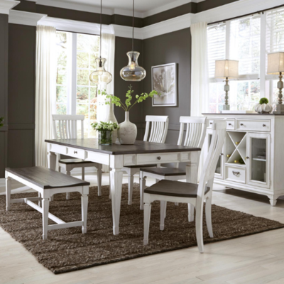 a dining room with white furniture