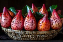 a basket of fruit with red and black dots