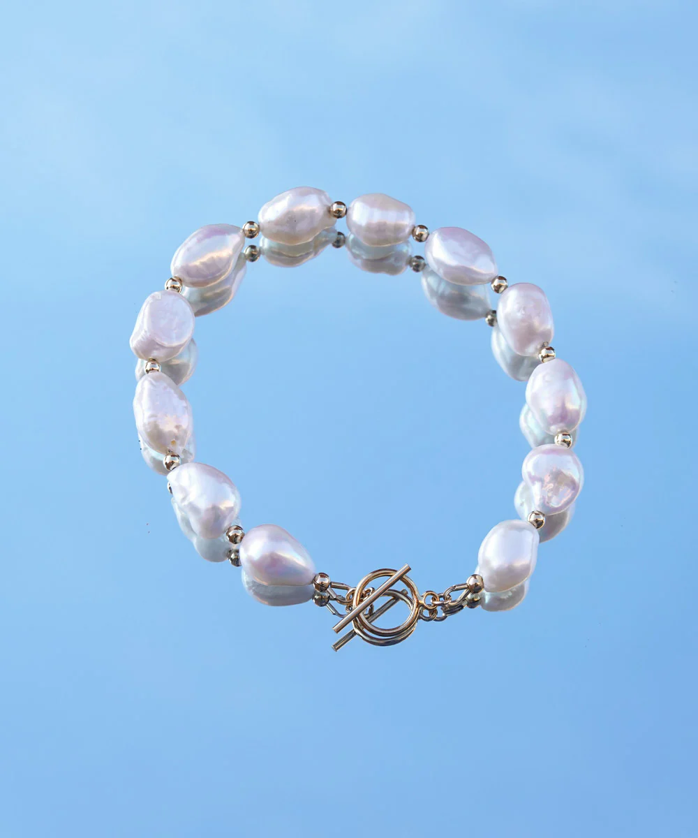 a bracelet with pearls on it