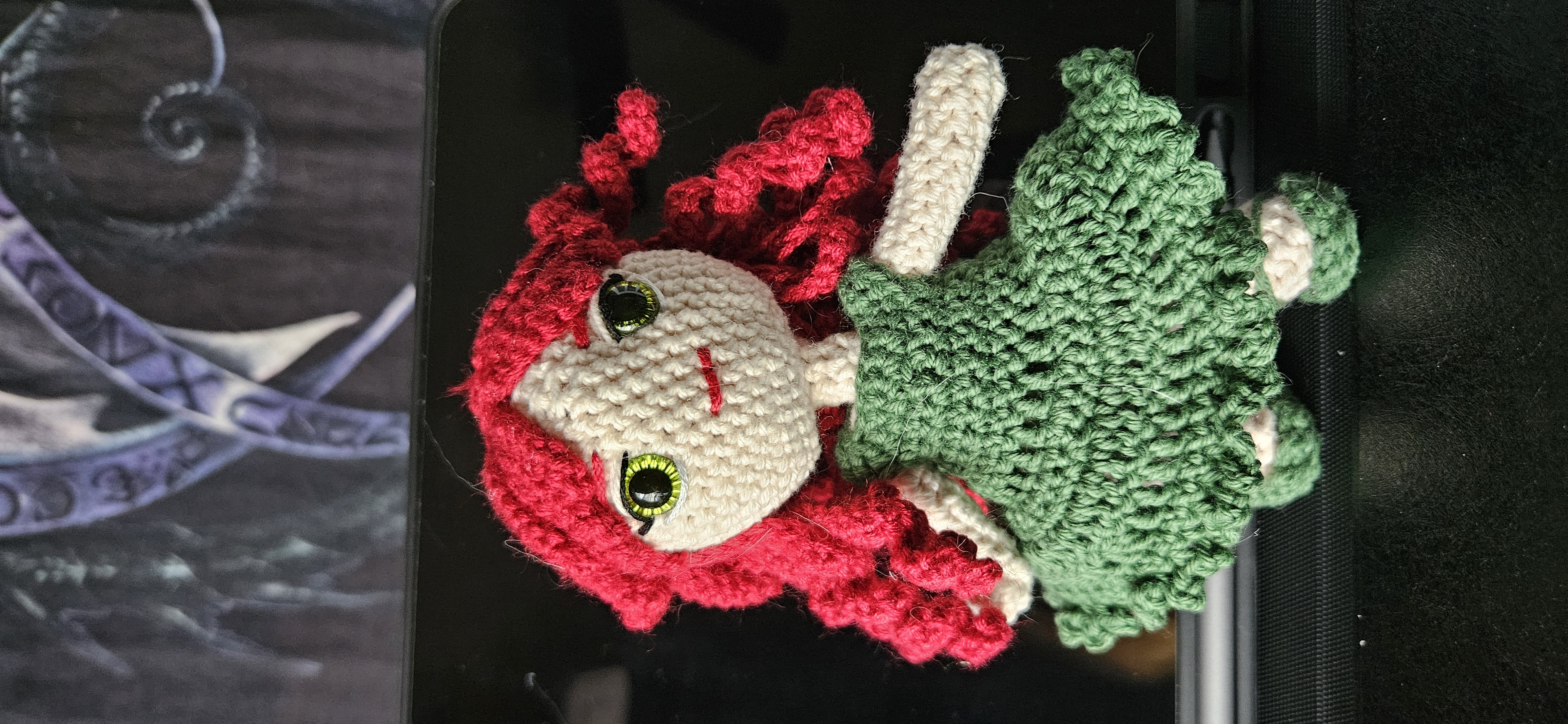 a knitted doll with red hair