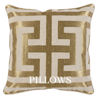 a pillow with a gold design