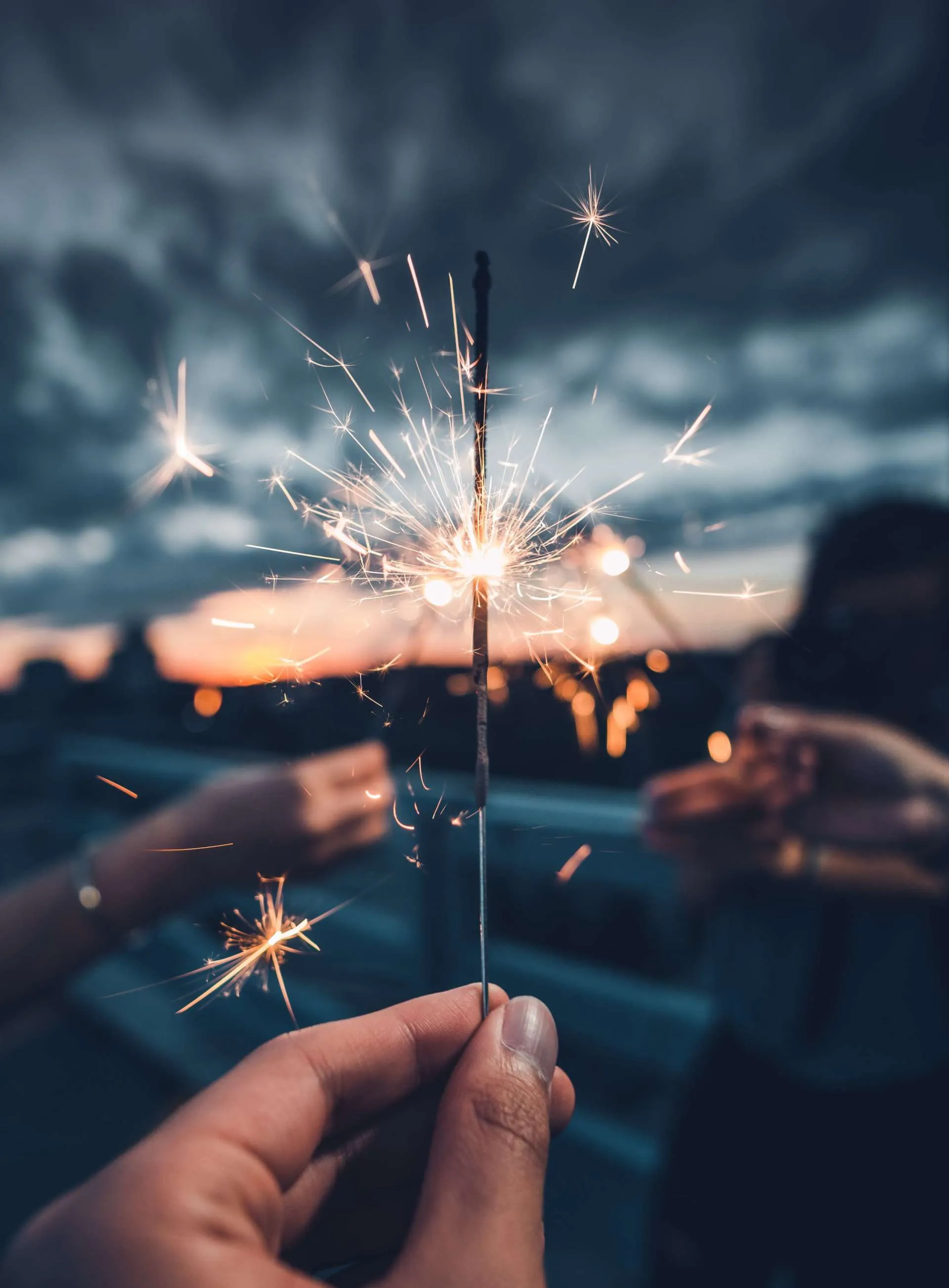 a person holding a sparkler