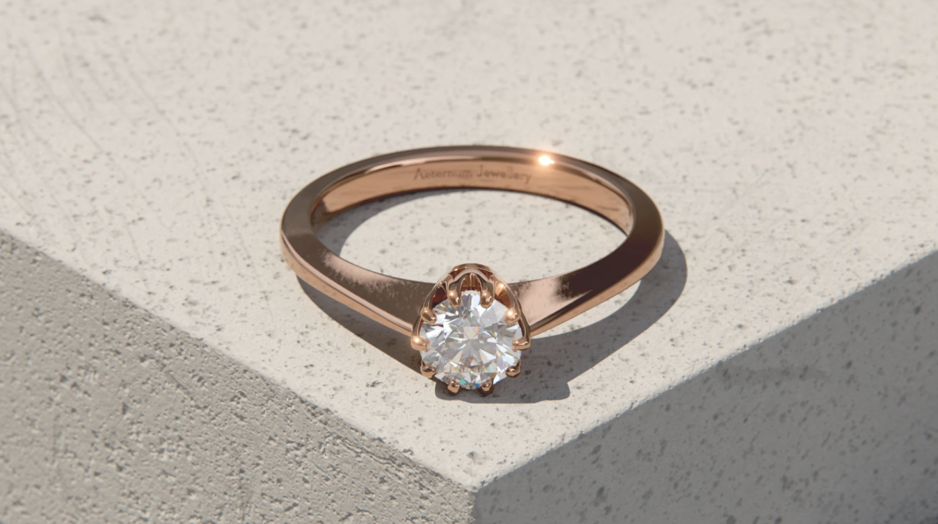 a gold ring with a diamond