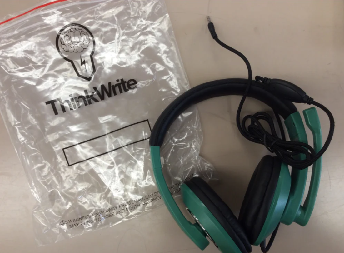 a green headphones on a plastic bag