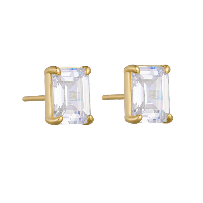 a pair of gold earrings with a square cut stone