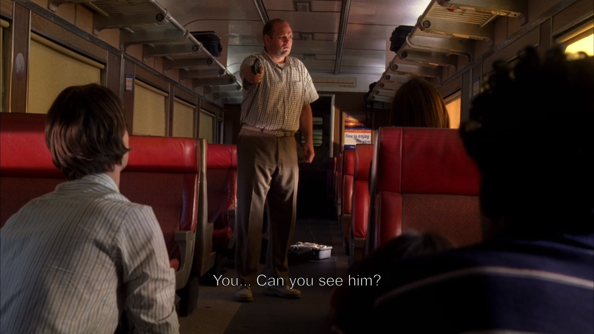 a man standing in a train