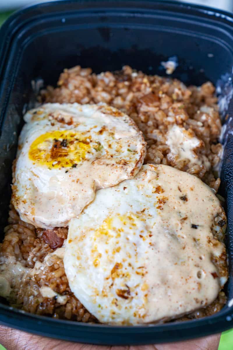 a plate of food with eggs and rice