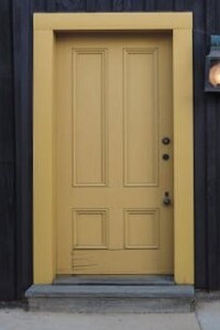 a yellow door with a light