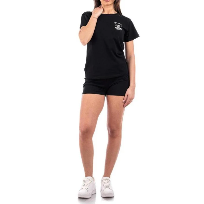 a woman in black shirt and shorts
