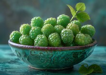 a bowl of green raspberries